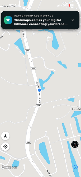 A WilDi city-wide background ad delivered on a driver's phone